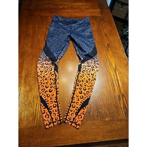 Violate the Dress Code Leggings Animal Print Blk & Orange Size Medium (A934)